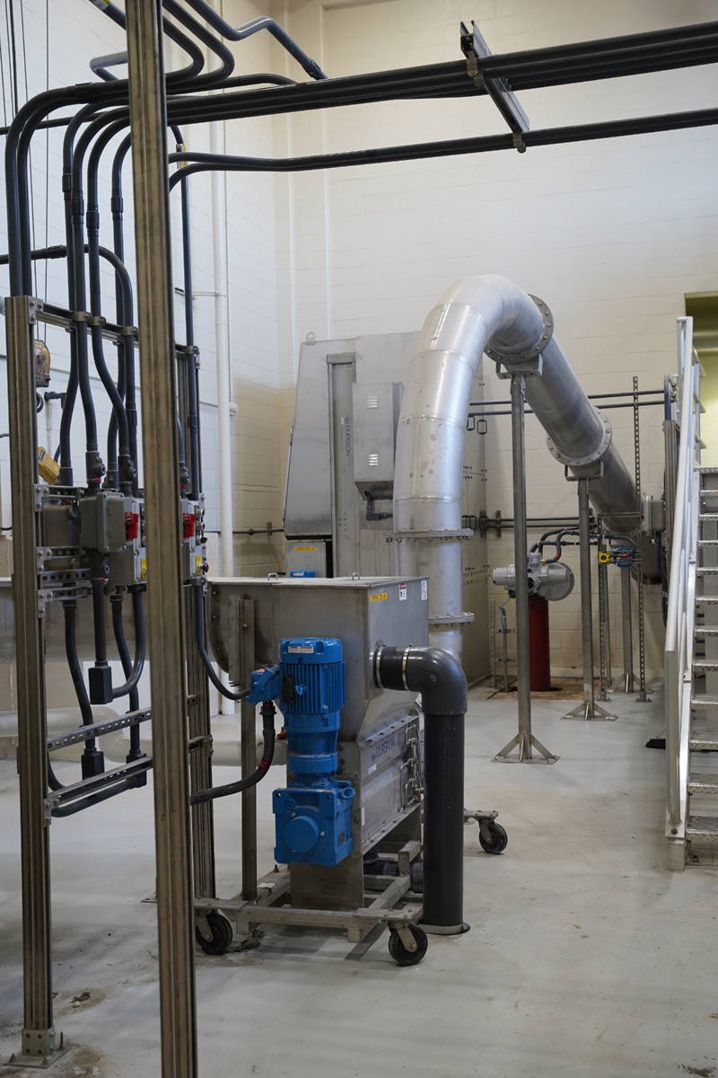 Duperon washer compactor discharge extension option