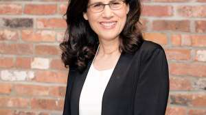 Carol fishman cohen heashot brick background