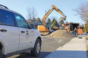 Construction Job Site Overview With City Of Hamilton Vehicle