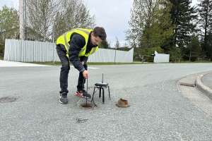 Nick Druyvestein Lowers Sensor Onto Mainline Valve