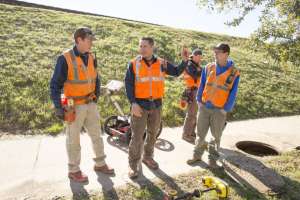 Workers safety vests manhole